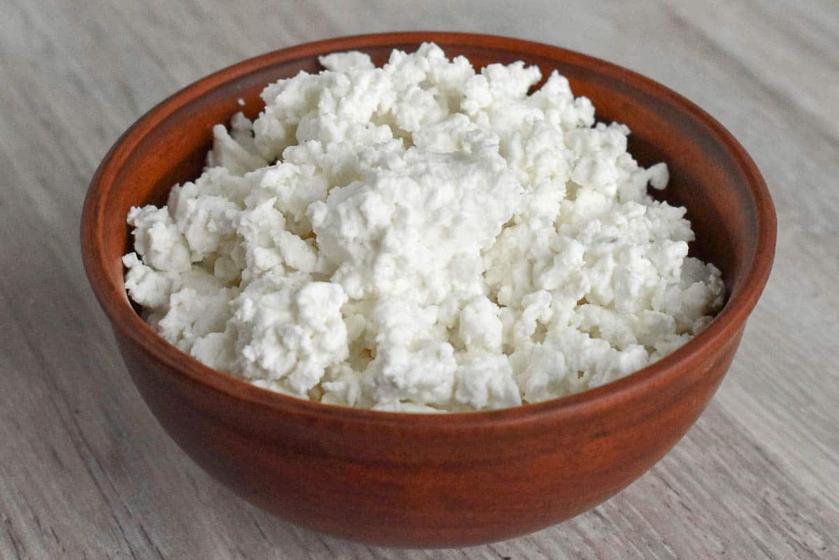 wooden bowl of cottage cheese