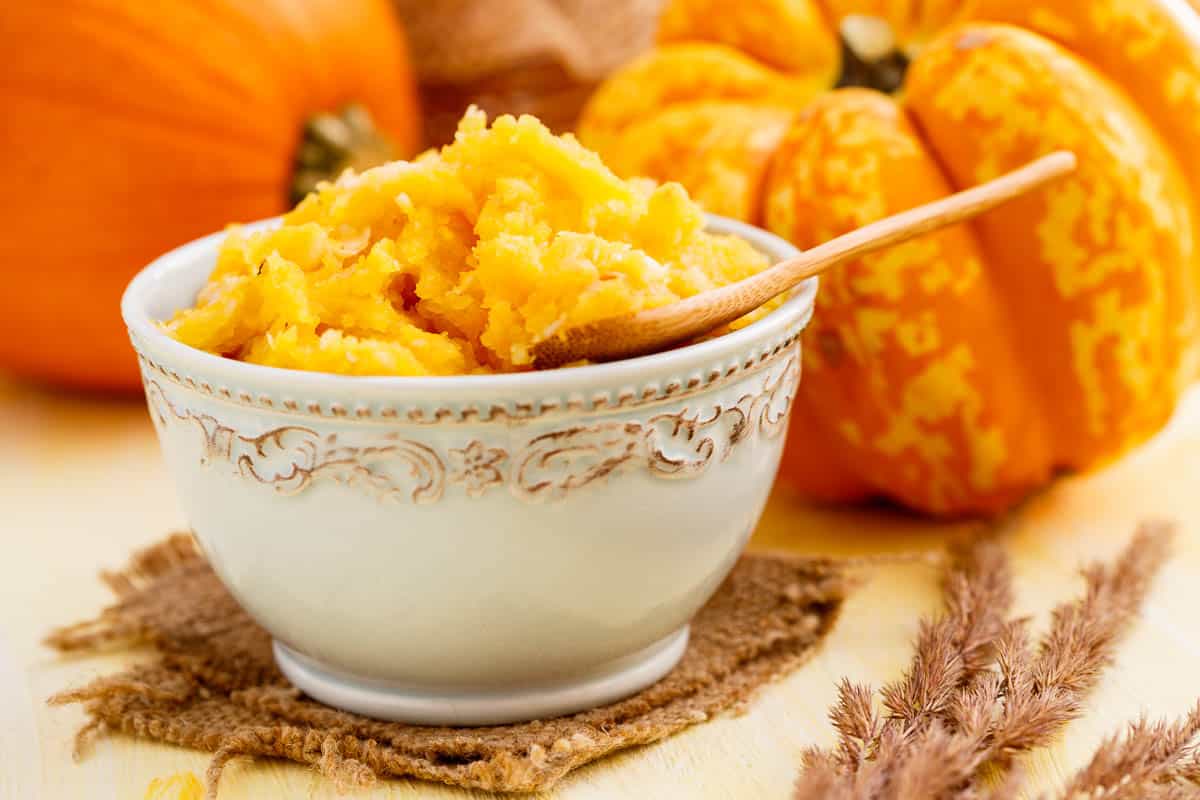 Homemade pumpkin puree in ceramic bowl