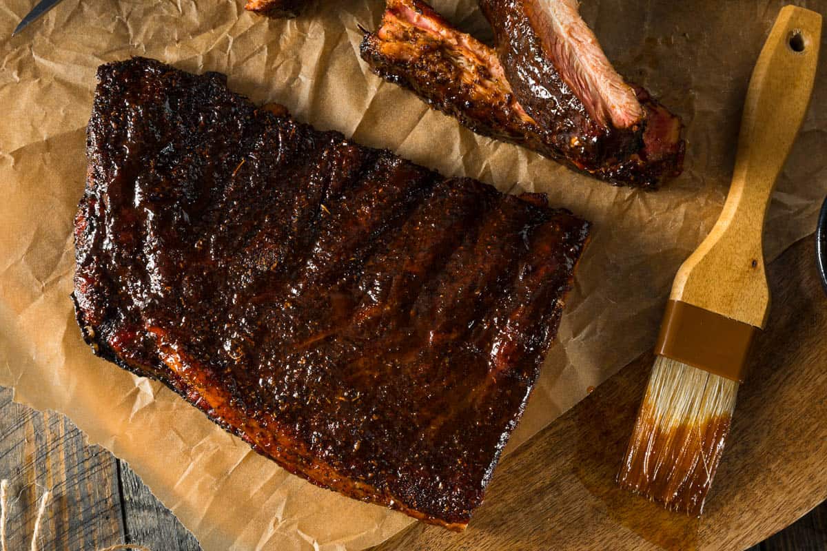 Homemade Smoked Barbecue St. Louis Style Pork Ribs with Sauce.