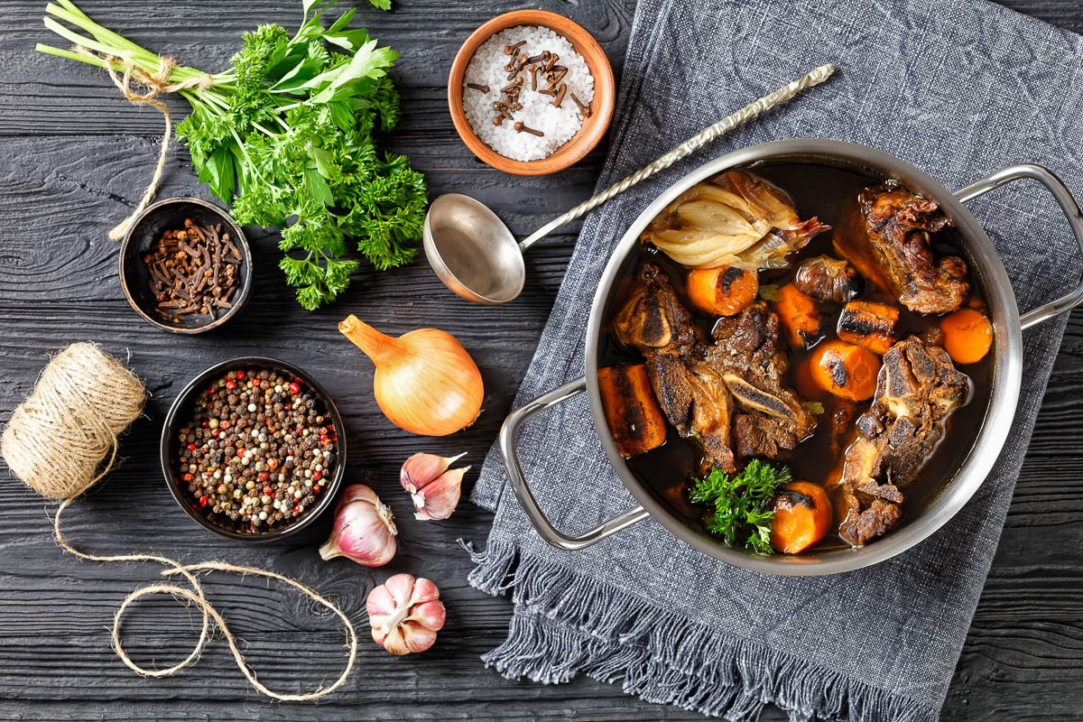 beef broth of beef meat on bones slow cooked with charred vegetables: carrot, onion, garlic.