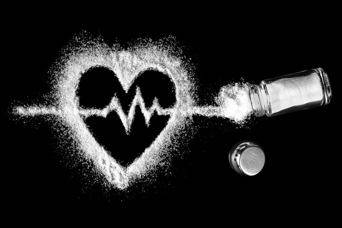 Heart shaped salt with a cardiogram inside with a salt shaker