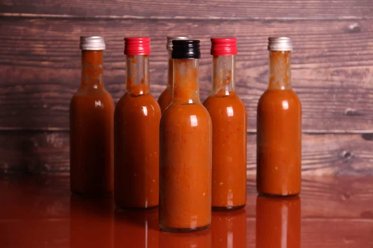 Hot sauce on a table.