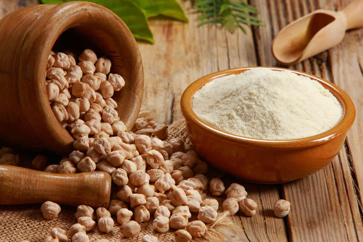 bowl of chickpea flour with dried garbanzo beans.