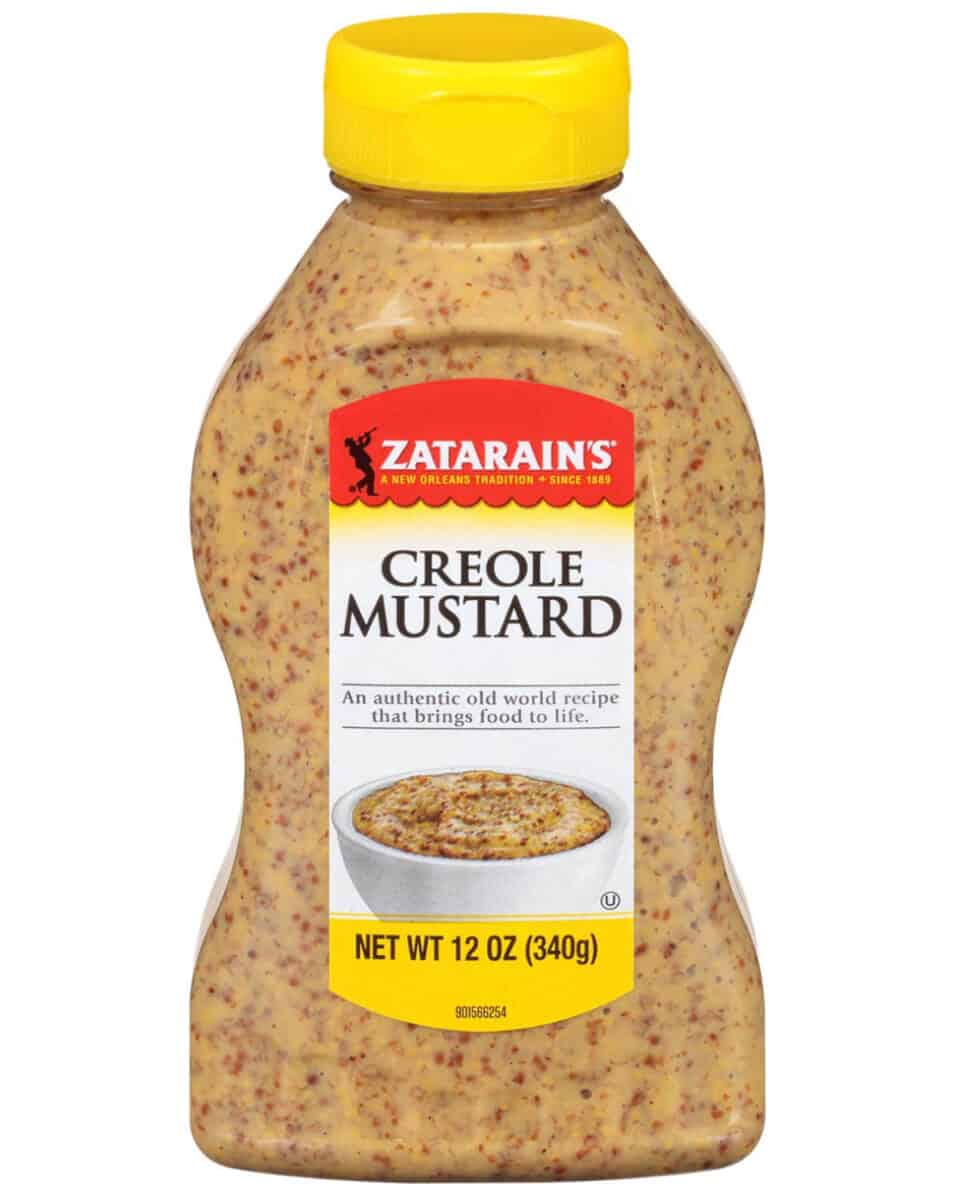 bottle of creole mustard on white background.