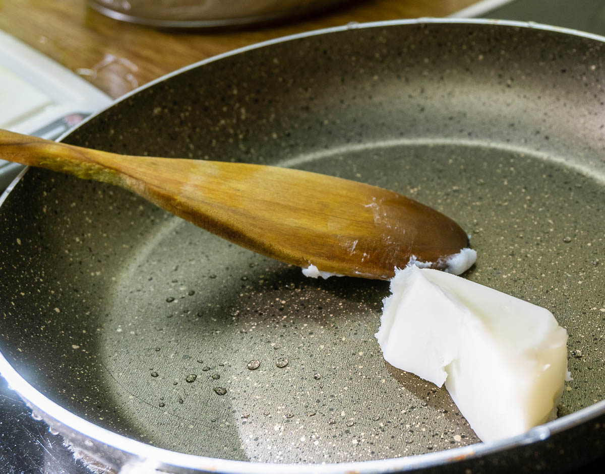 Close up of pork fat inside a cooking pan.