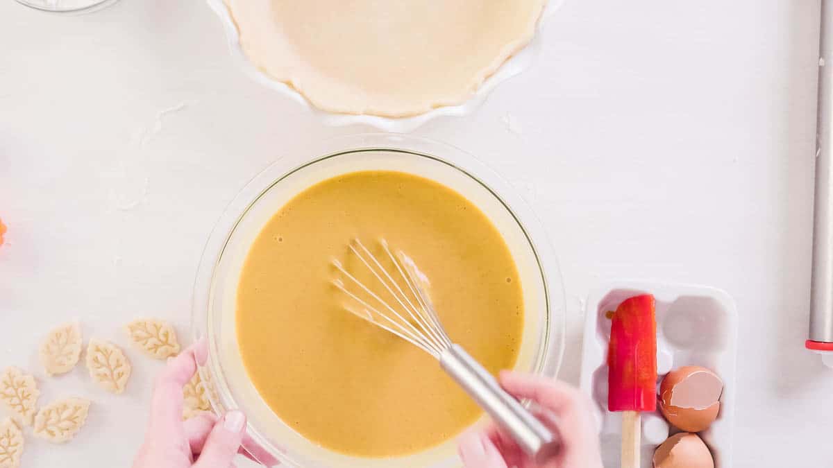 Preparing traditional pumpkin pie for Thanksgiving dinner.