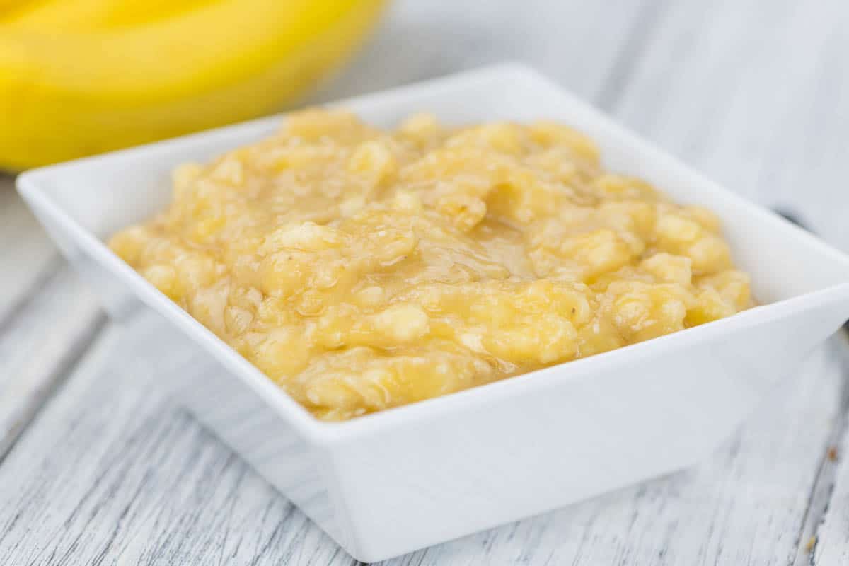 Mashed Bananas in square white dish.