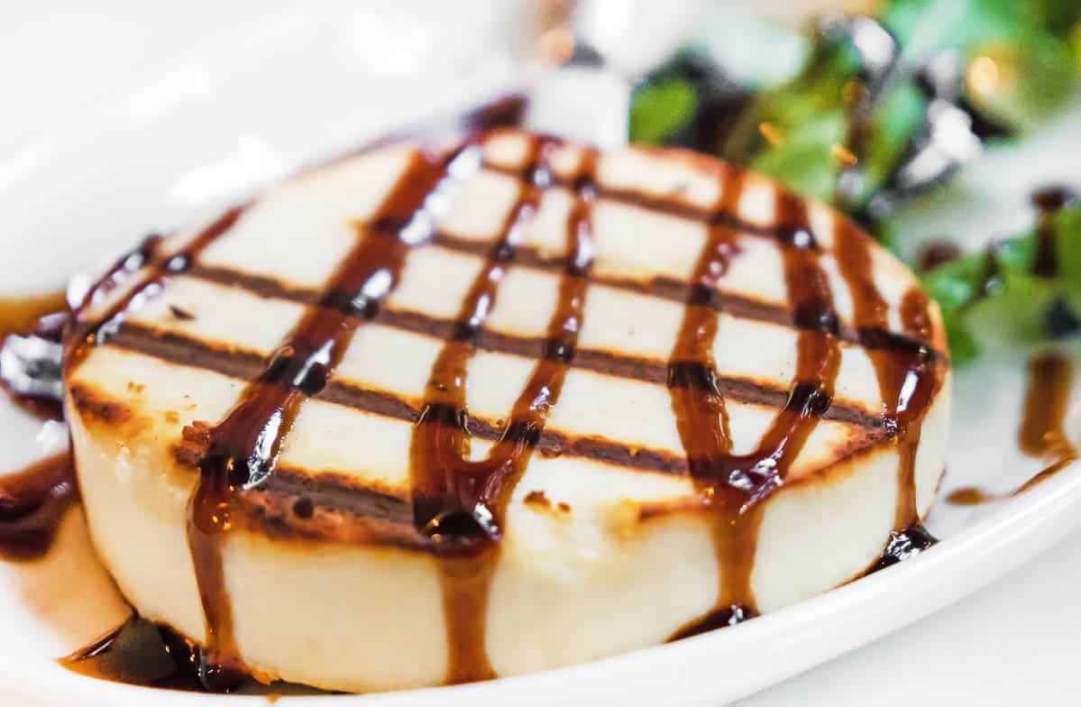 Grilled Manouri cheese topped with balsamic vinegar and fig