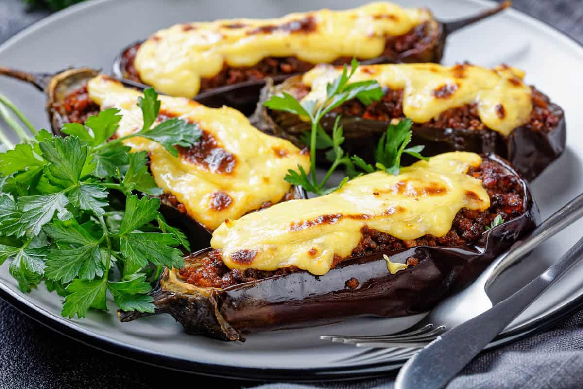 Greek stuffed eggplants with ground beef, tomatoes, topped with bechamel sauce with chees