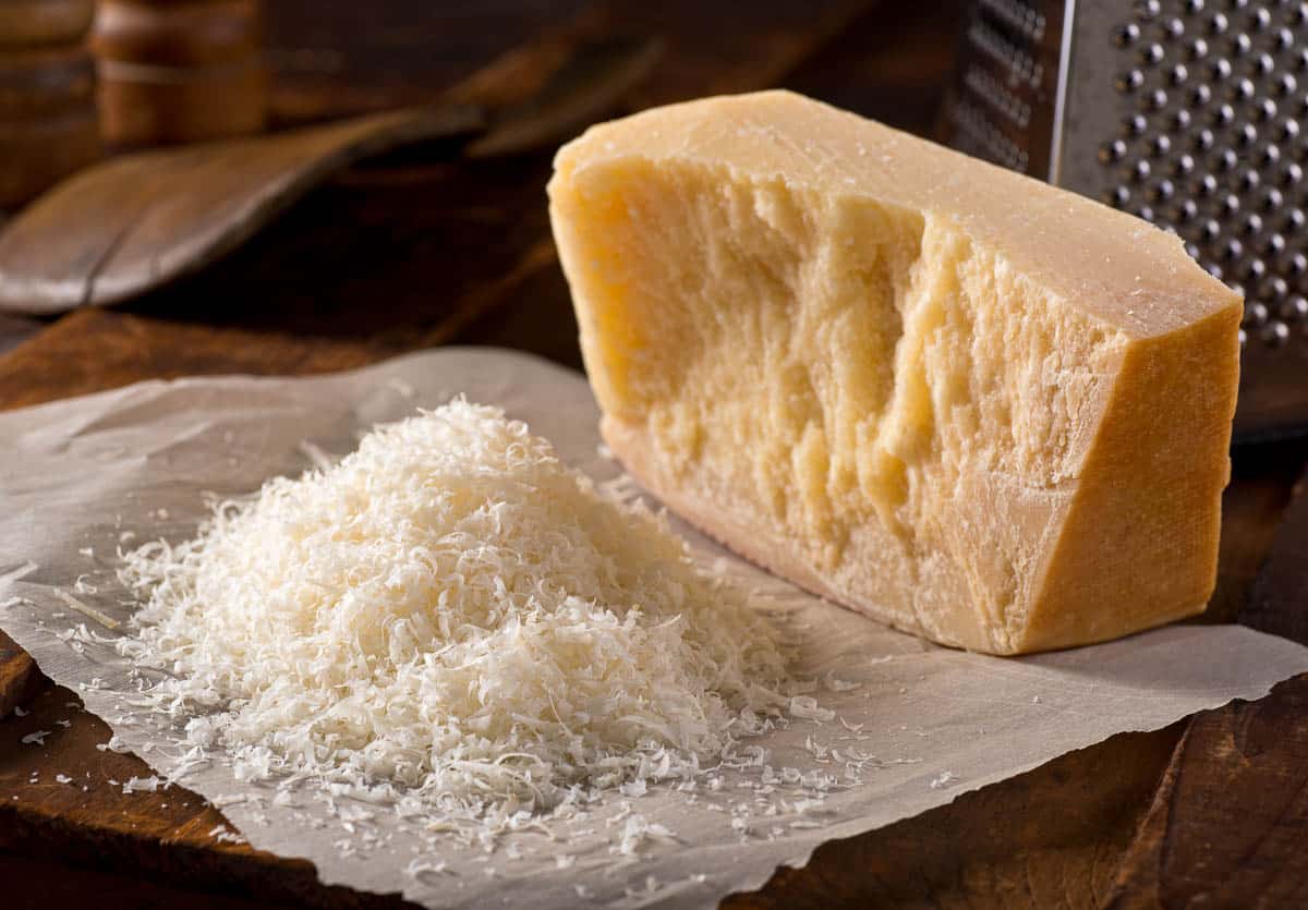 Freshly grated parmigiano reggiano parmesan cheese..