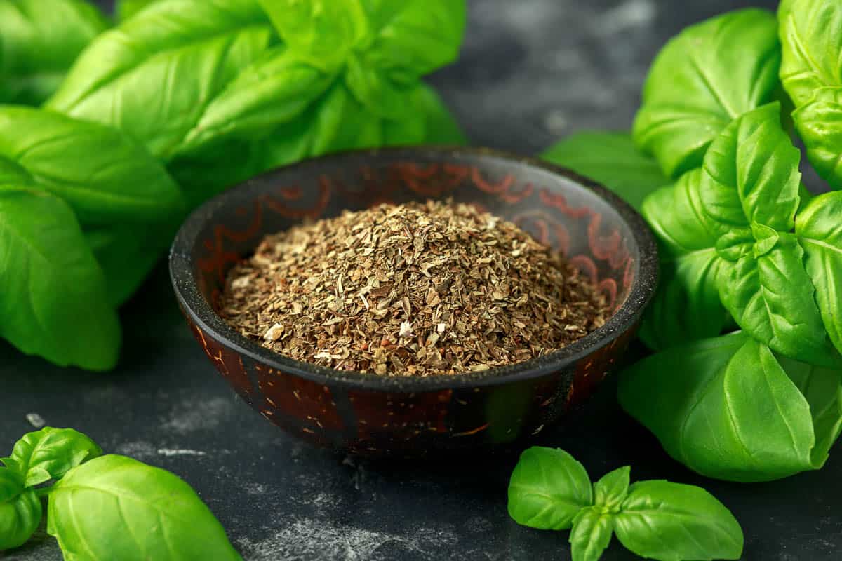 Fresh and dried basil in bowl.