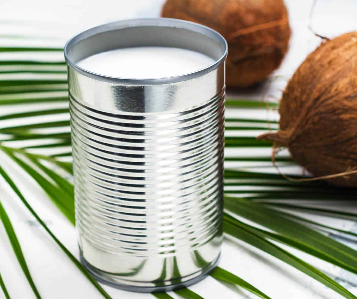 Opened tin can with coconut milk drink.