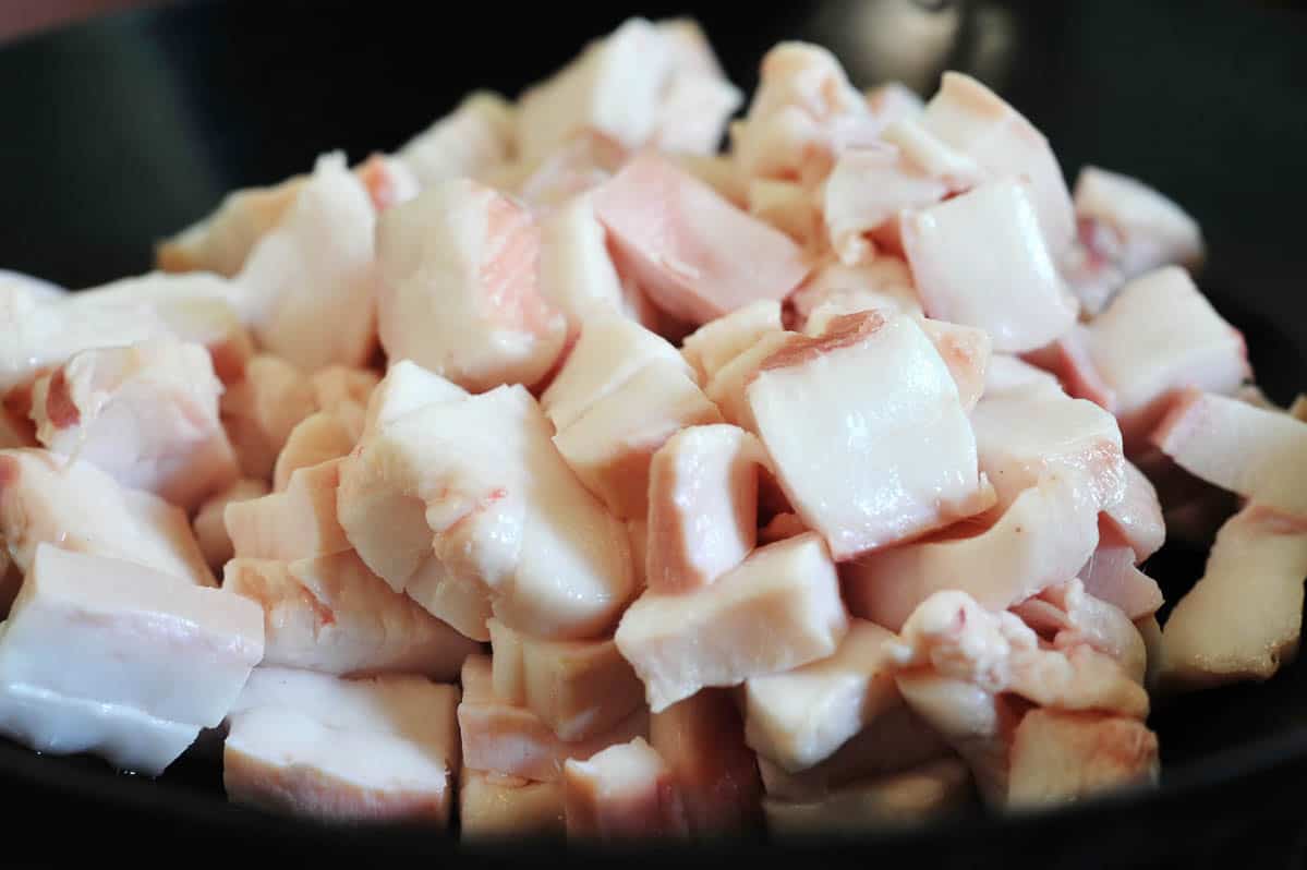 Uncooked cubes of pork for cooking pork lard.