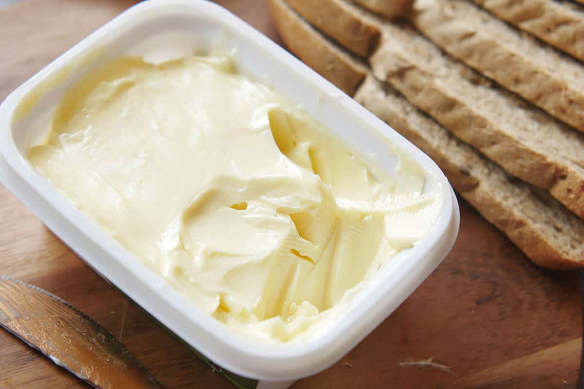 tub of margarine with sliced bread.