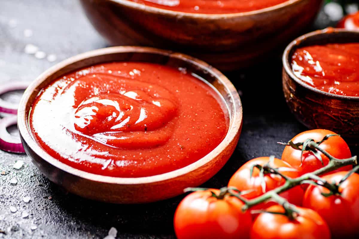 small bowl of homemade ketchup with cherry tomatoes