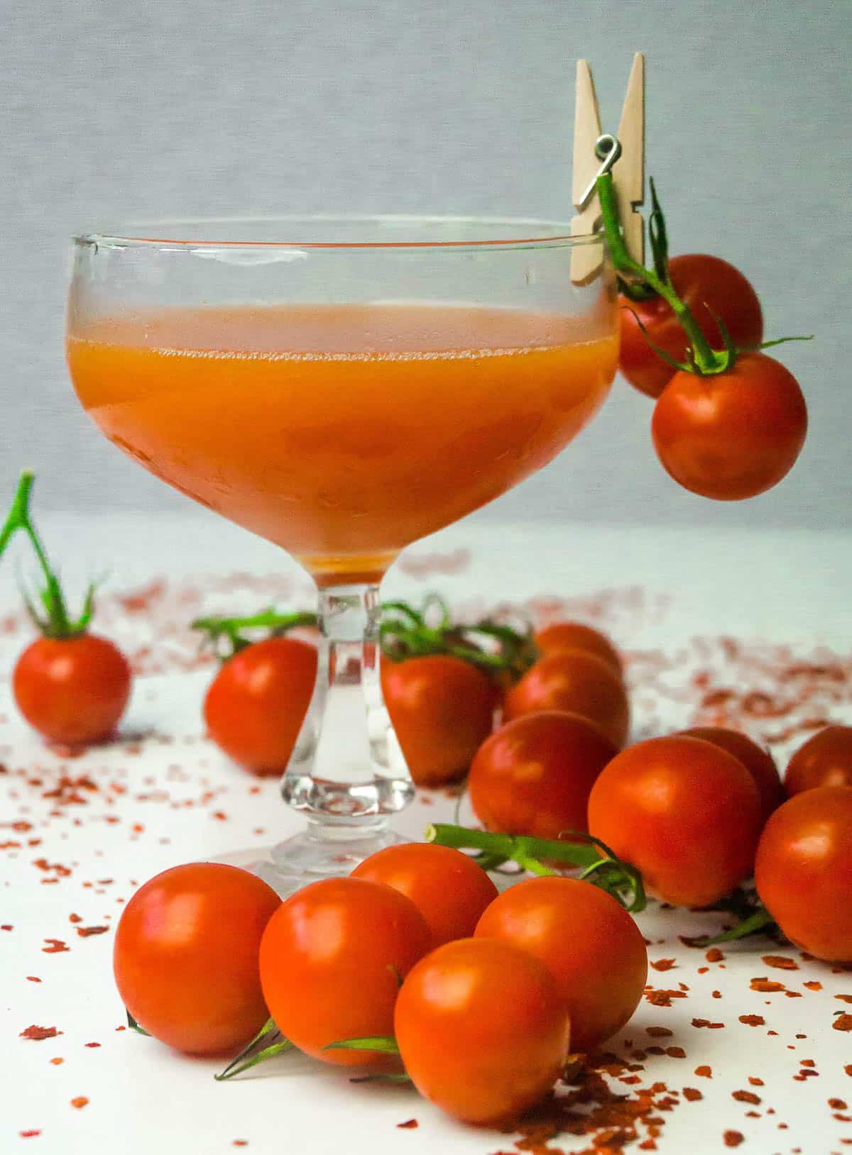 glass of tomato juice with cherry tomatoes