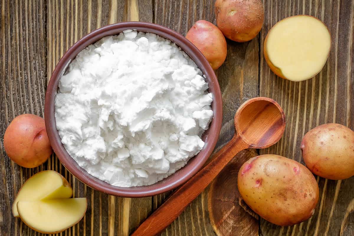 potato starch in bowl with red potatoes.