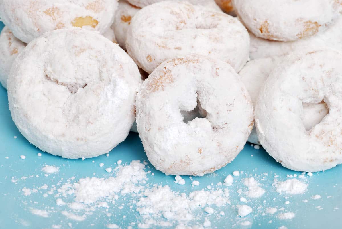 small icing sugar covered donuts.