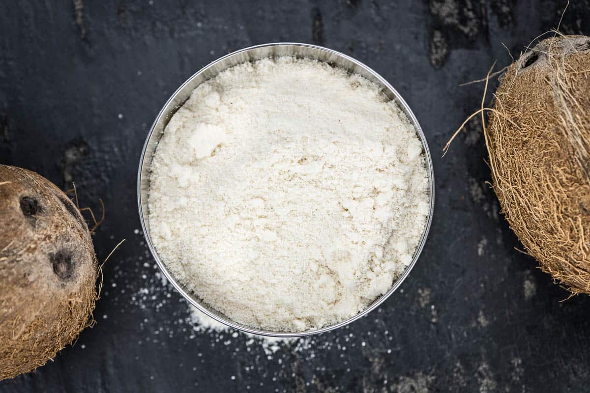 Coconut flour (fresh) as detailed close-up shot, selective focus).