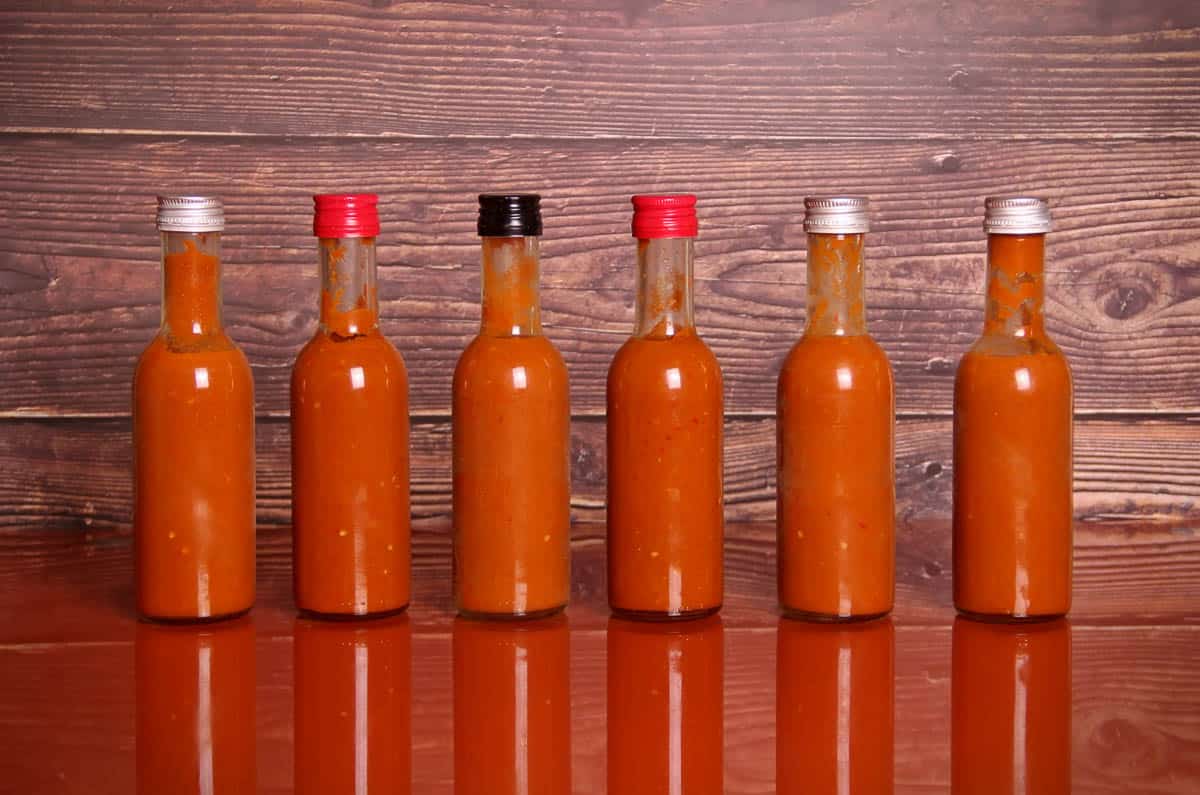 Hot sauce on a table.